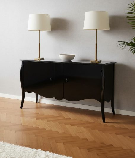 Schwarzer Konsolentisch mit goldenen Lampen und einer Schüssel auf der Oberfläche.